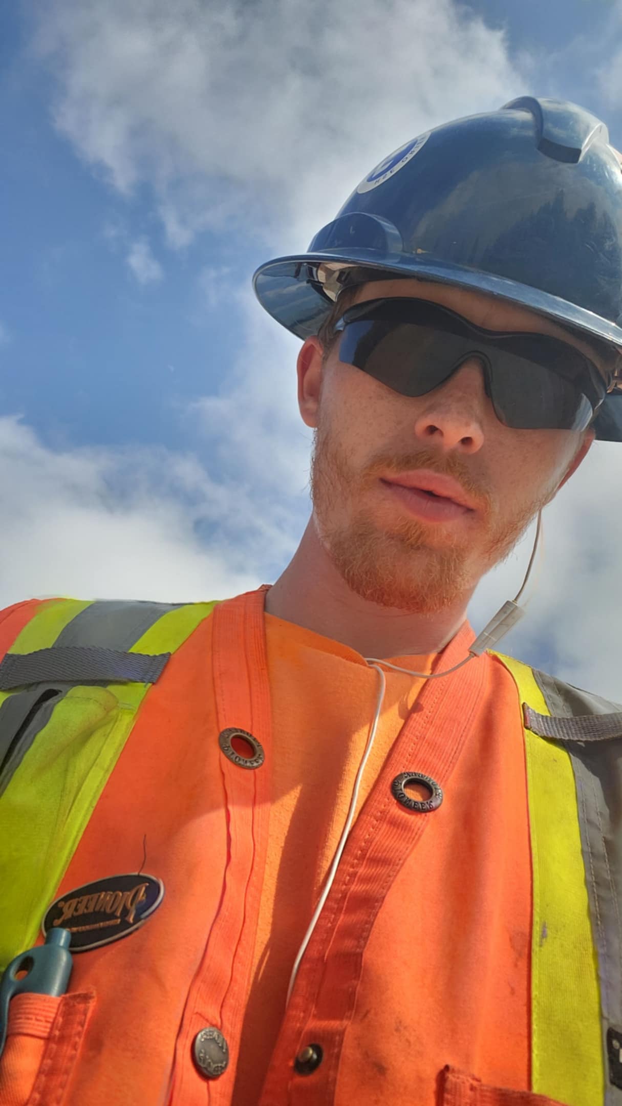 Austin Miller, owner and lead landscaper at A.M Landscape, standing on site