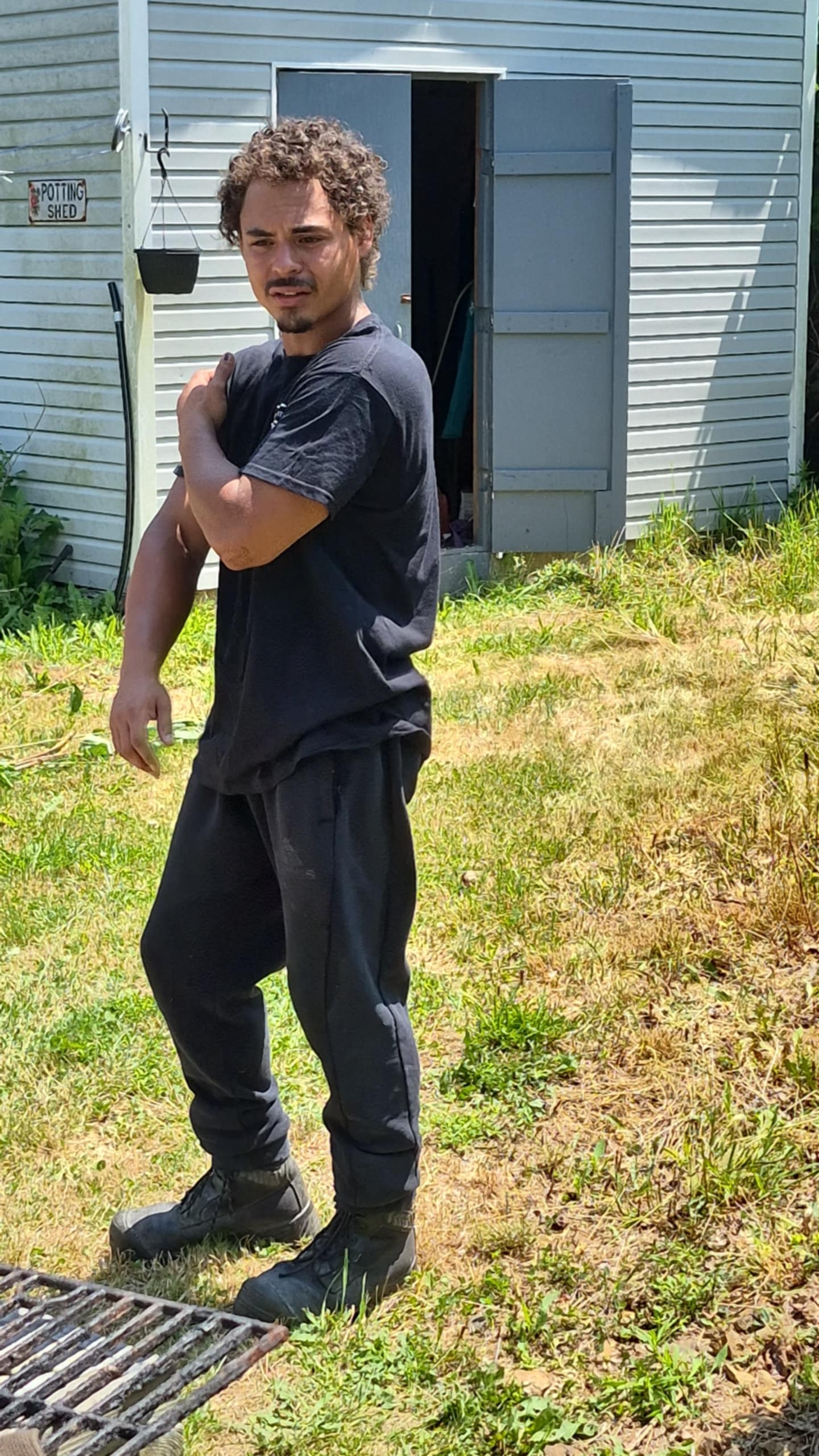 Dustin, supervisor and foreman at A.M Landscape, standing on a landscaping worksite